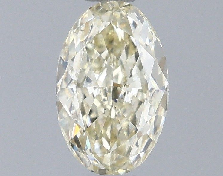 0.56 CT Fancy Light Yellow OVAL
