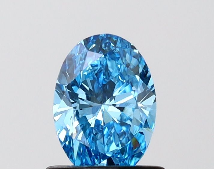 0.74 CT Fancy Vivid Blue OVAL